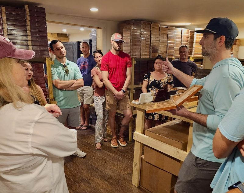 Danny Rodriguez, owner and grandson of the founders, giving a presentation to the tour group inside Rodriguez Cigar Factory in Key West