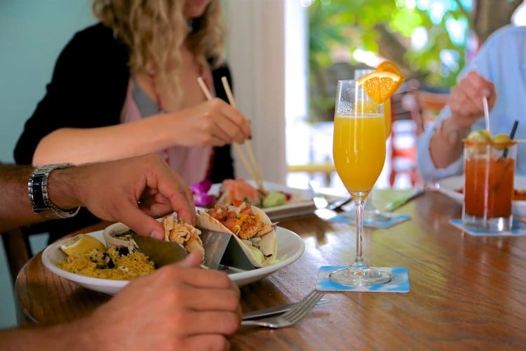 mimosas, bloody marys, and $5 appetizers being eaten during Bagatelle happy hour.