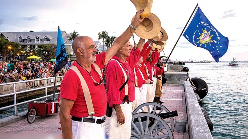 a man carrying a large umbrella